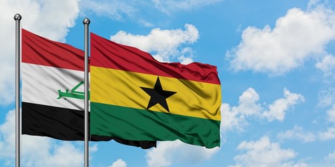 Iraq and Ghana flag waving in the wind against white cloudy blue sky together. Diplomacy concept, international relations.