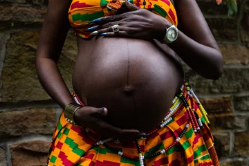 Fotobehang Afrika woman holding pregnant belly  © Jennie