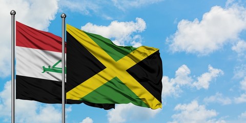 Iraq and Jamaica flag waving in the wind against white cloudy blue sky together. Diplomacy concept, international relations.