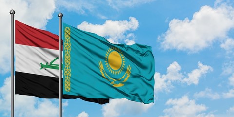 Iraq and Kazakhstan flag waving in the wind against white cloudy blue sky together. Diplomacy concept, international relations.