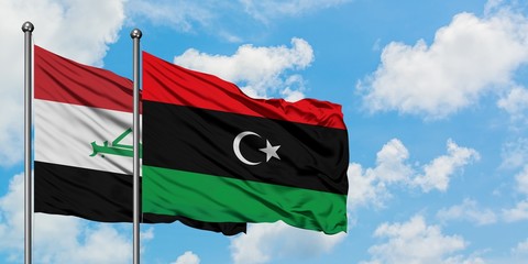 Iraq and Libya flag waving in the wind against white cloudy blue sky together. Diplomacy concept,...
