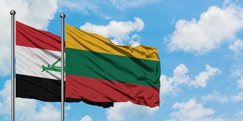 Iraq and Lithuania flag waving in the wind against white cloudy blue sky together. Diplomacy concept, international relations.