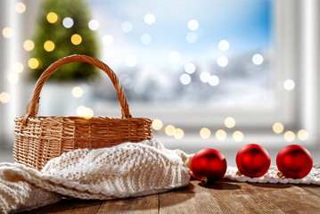 Table background of free space for your decoration and winter window background.Christmas tree.Winter landscape of mountains. Blurred lights.Copy space. 