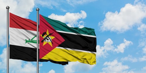 Iraq and Mozambique flag waving in the wind against white cloudy blue sky together. Diplomacy concept, international relations.