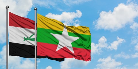 Iraq and Myanmar flag waving in the wind against white cloudy blue sky together. Diplomacy concept,...