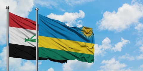 Iraq and Rwanda flag waving in the wind against white cloudy blue sky together. Diplomacy concept, international relations.