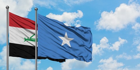 Iraq and Somalia flag waving in the wind against white cloudy blue sky together. Diplomacy concept, international relations.