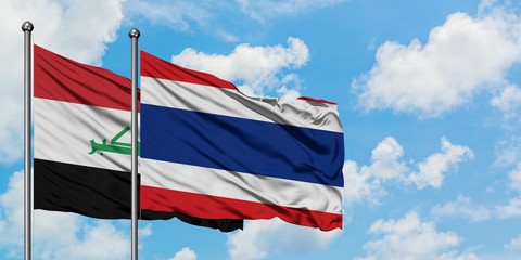 Iraq and Thailand flag waving in the wind against white cloudy blue sky together. Diplomacy concept, international relations.