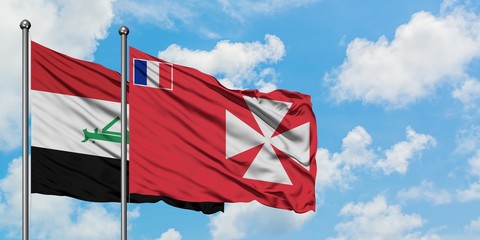 Iraq and Wallis And Futuna flag waving in the wind against white cloudy blue sky together. Diplomacy concept, international relations.