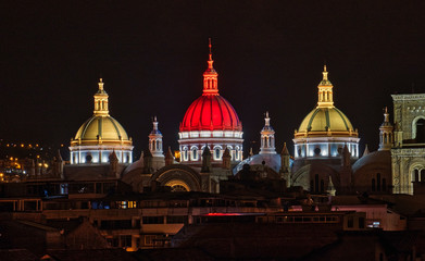 New Cathedral Domes in Cuenca, Ecuador are illuminated in the city flag colors for Independence...