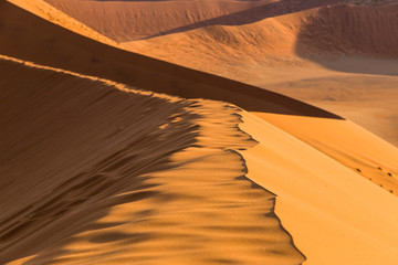 Fototapeta na wymiar Colourful Namibian dunes in Namibia's Naukluft Park at the end of the day
