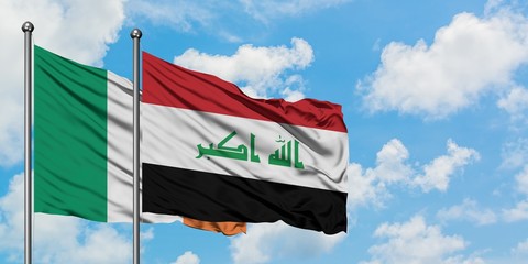 Ireland and Iraq flag waving in the wind against white cloudy blue sky together. Diplomacy concept, international relations.