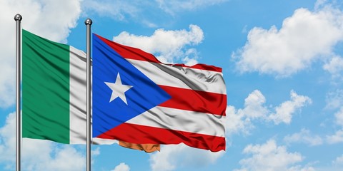 Ireland and Puerto Rico flag waving in the wind against white cloudy blue sky together. Diplomacy concept, international relations.