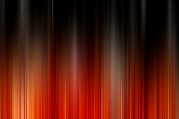 Abstract vertical orange and black lines background. Streaks are blurry in motion.
