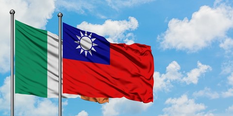 Ireland and Taiwan flag waving in the wind against white cloudy blue sky together. Diplomacy concept, international relations.