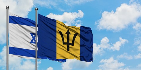 Israel and Barbados flag waving in the wind against white cloudy blue sky together. Diplomacy concept, international relations.