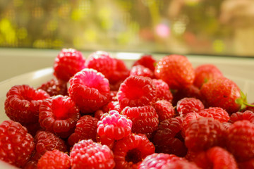 fresh raspberries on wooden background