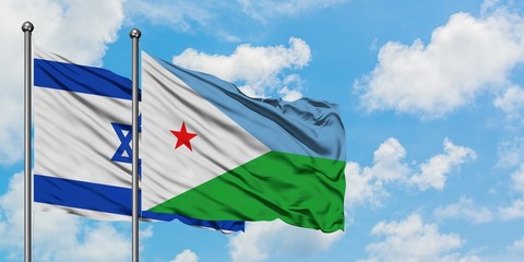 Israel and Djibouti flag waving in the wind against white cloudy blue sky together. Diplomacy concept, international relations.