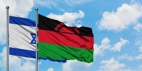Israel and Malawi flag waving in the wind against white cloudy blue sky together. Diplomacy...