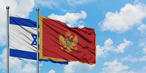 Israel and Montenegro flag waving in the wind against white cloudy blue sky together. Diplomacy concept, international relations.