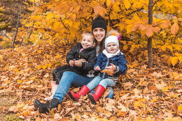 A portrait of a young family in the autumn park