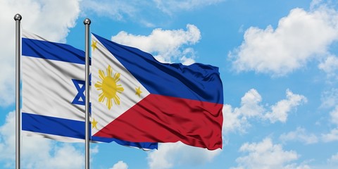 Israel and Philippines flag waving in the wind against white cloudy blue sky together. Diplomacy concept, international relations.