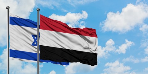 Israel and Yemen flag waving in the wind against white cloudy blue sky together. Diplomacy concept, international relations.