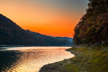 Forest lake at autumn sunset. Vodojaza lake near the Kragujevac in Serbia.