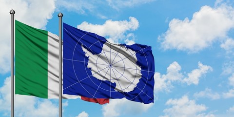 Italy and Antarctica flag waving in the wind against white cloudy blue sky together. Diplomacy...