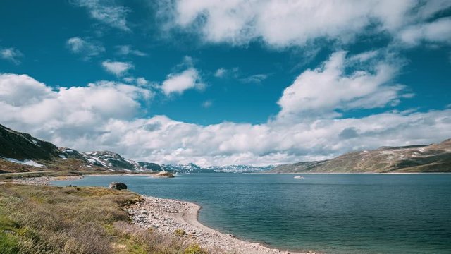 Oppland, Tyin Lake, Norway. Stones On Coast Of Beautiful Lake Tyin In Summer Day. Norwegian Nature. 4K