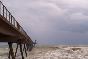 pier in a sea storm