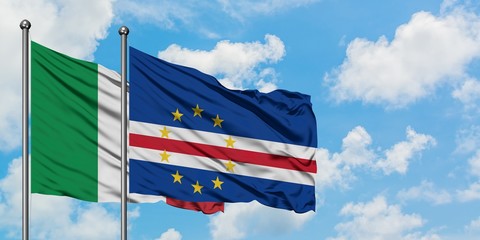 Italy and Cape Verde flag waving in the wind against white cloudy blue sky together. Diplomacy concept, international relations.