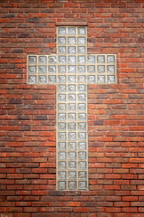 glass cross on church wall