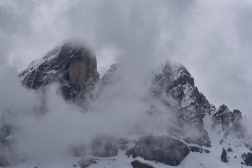 Mountain peaks with snow in fog