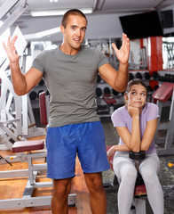 Coach and girl checking with workout plan