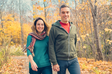 Fototapeta premium happy autumn fall couple in a park