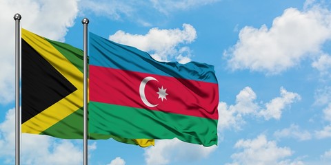 Jamaica and Azerbaijan flag waving in the wind against white cloudy blue sky together. Diplomacy concept, international relations.