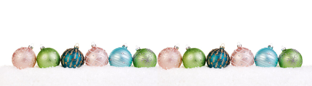 Colorful christmas balls in a row on snow, Christmas banner