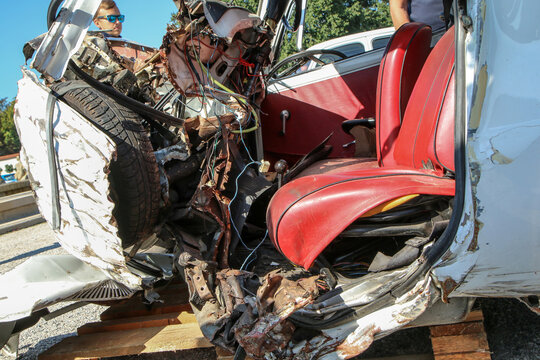 The detail of an old veteran small car after the collision with a modern car during the traffic accident. The car is destroyed completely. Shows the low level of passive safety. 