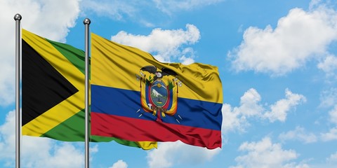 Jamaica and Ecuador flag waving in the wind against white cloudy blue sky together. Diplomacy concept, international relations.