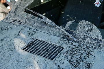 The detail of a car dirty from mud after the offroad race. It needs to be cleaned. 