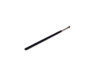 Black handle thin make up brush on white background.