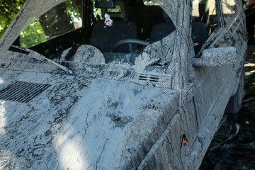 The detail of a car dirty from mud after the offroad race. It needs to be cleaned. 
