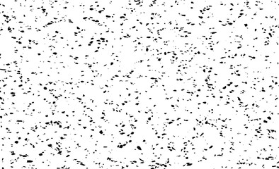 Small uneven spots and particles of debris. Abstract vector texture.  Distressed uneven background. Grunge texture overlay with fine grains isolated on white background. Vector illustration. EPS10.