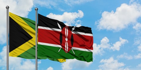 Jamaica and Kenya flag waving in the wind against white cloudy blue sky together. Diplomacy concept, international relations.