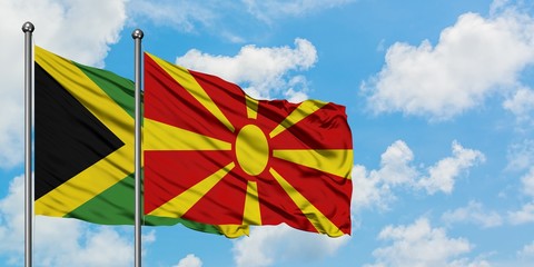 Jamaica and Macedonia flag waving in the wind against white cloudy blue sky together. Diplomacy concept, international relations.