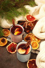 Winter hot tea with oranges and spices for Christmas