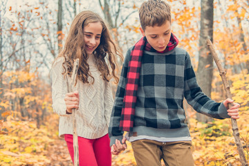 Fototapeta premium portrait of two child brother and sister in the autumn season outside