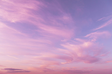 Dramatic sunrise, sunset pink violet sky with clouds background texture	
