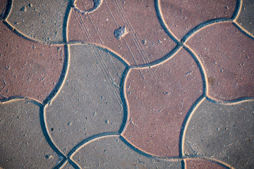 Texture of paving slabs overgrown with grass. Background image of a stratum stone